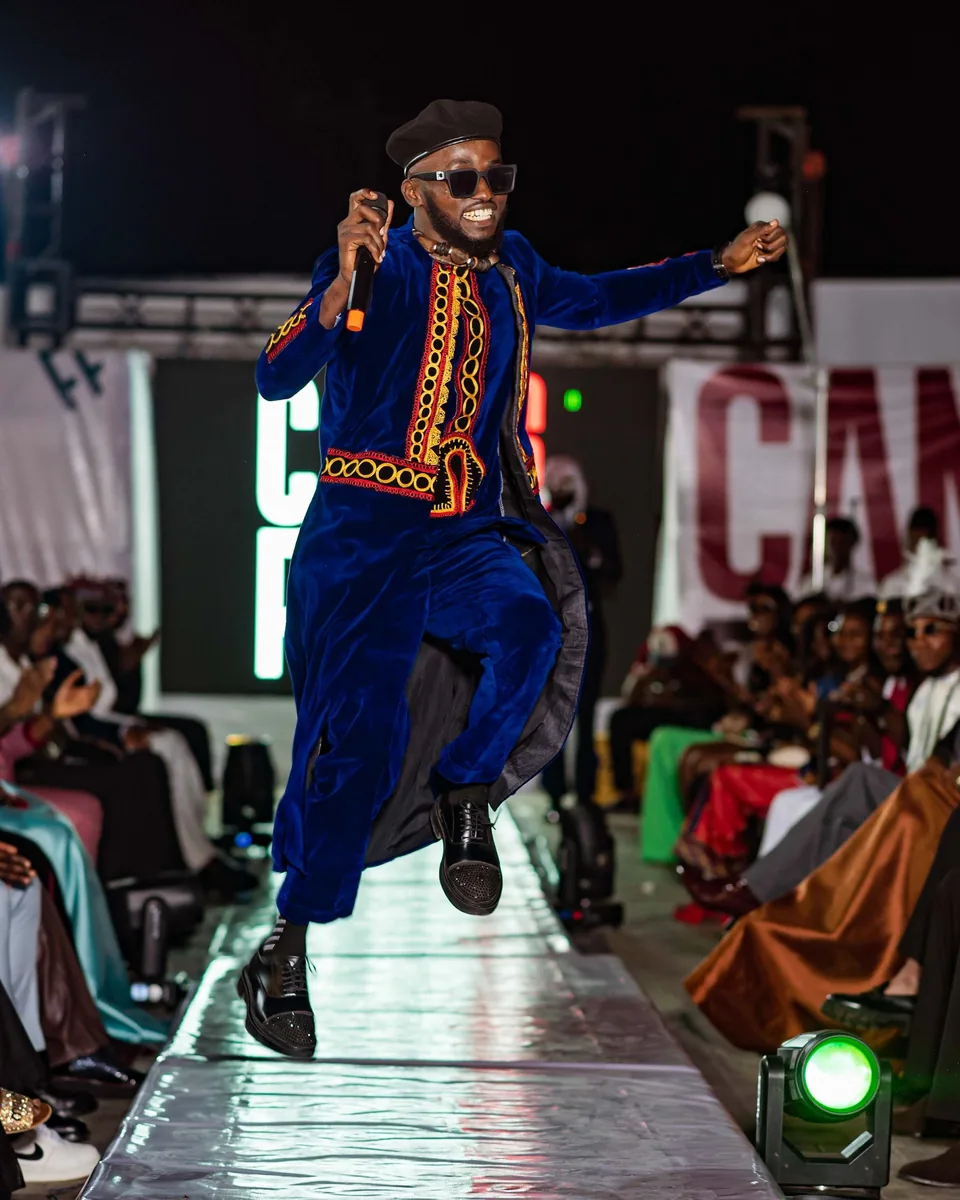 Performer leaping on the runway
